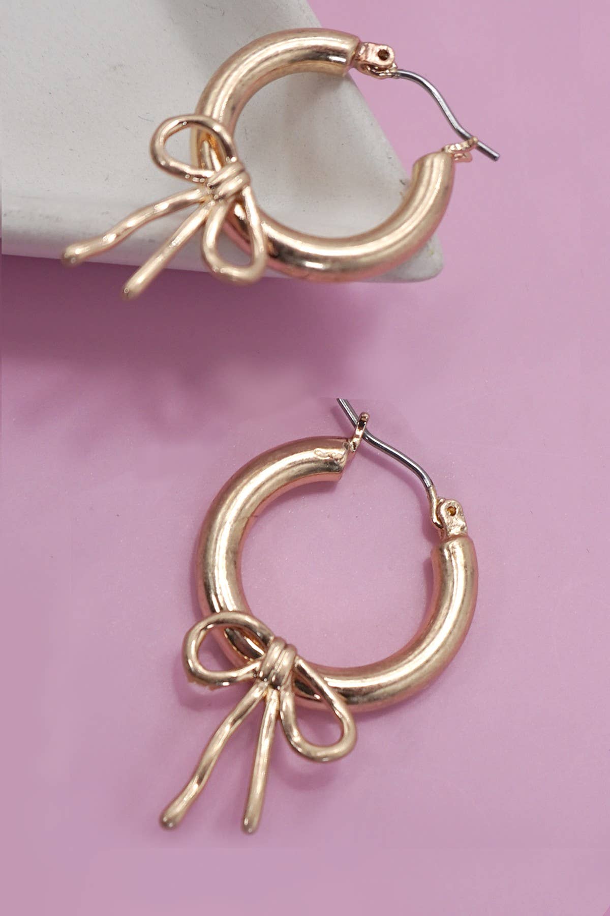 WORN GOLD BOW PUFFY HOOP EARRINGS