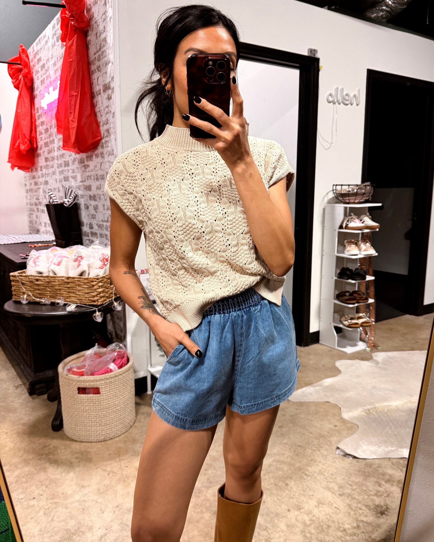 shorts paired with cable knit top