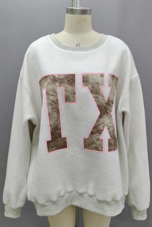 White sweatshirt with pink and brown design on a mannequin against a gray background