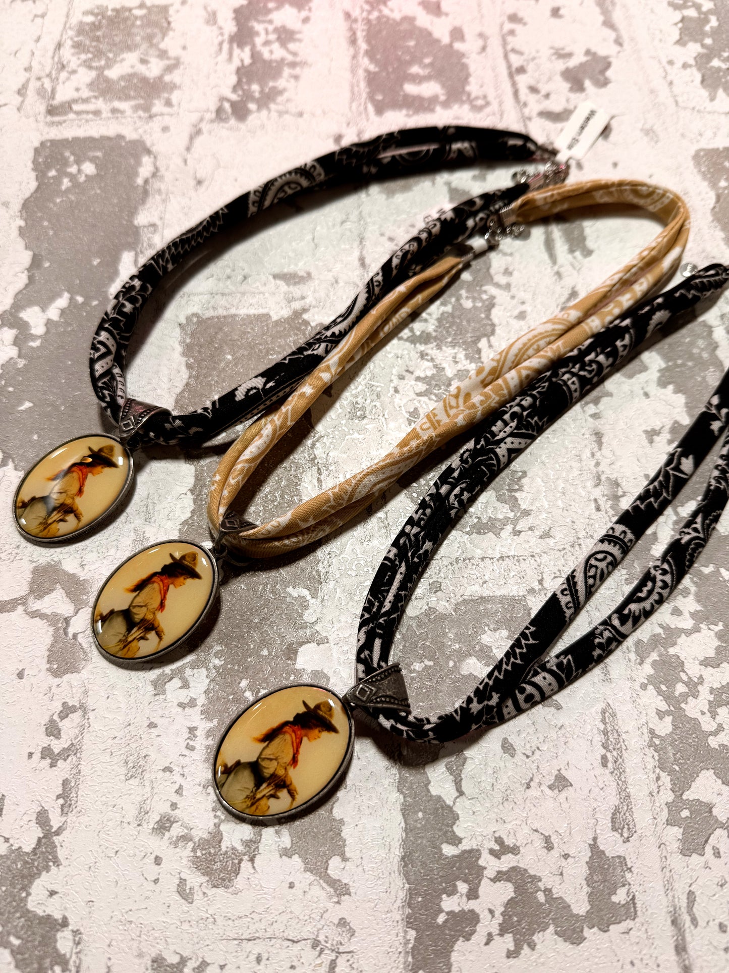 Necklace with pendant on a textured surface