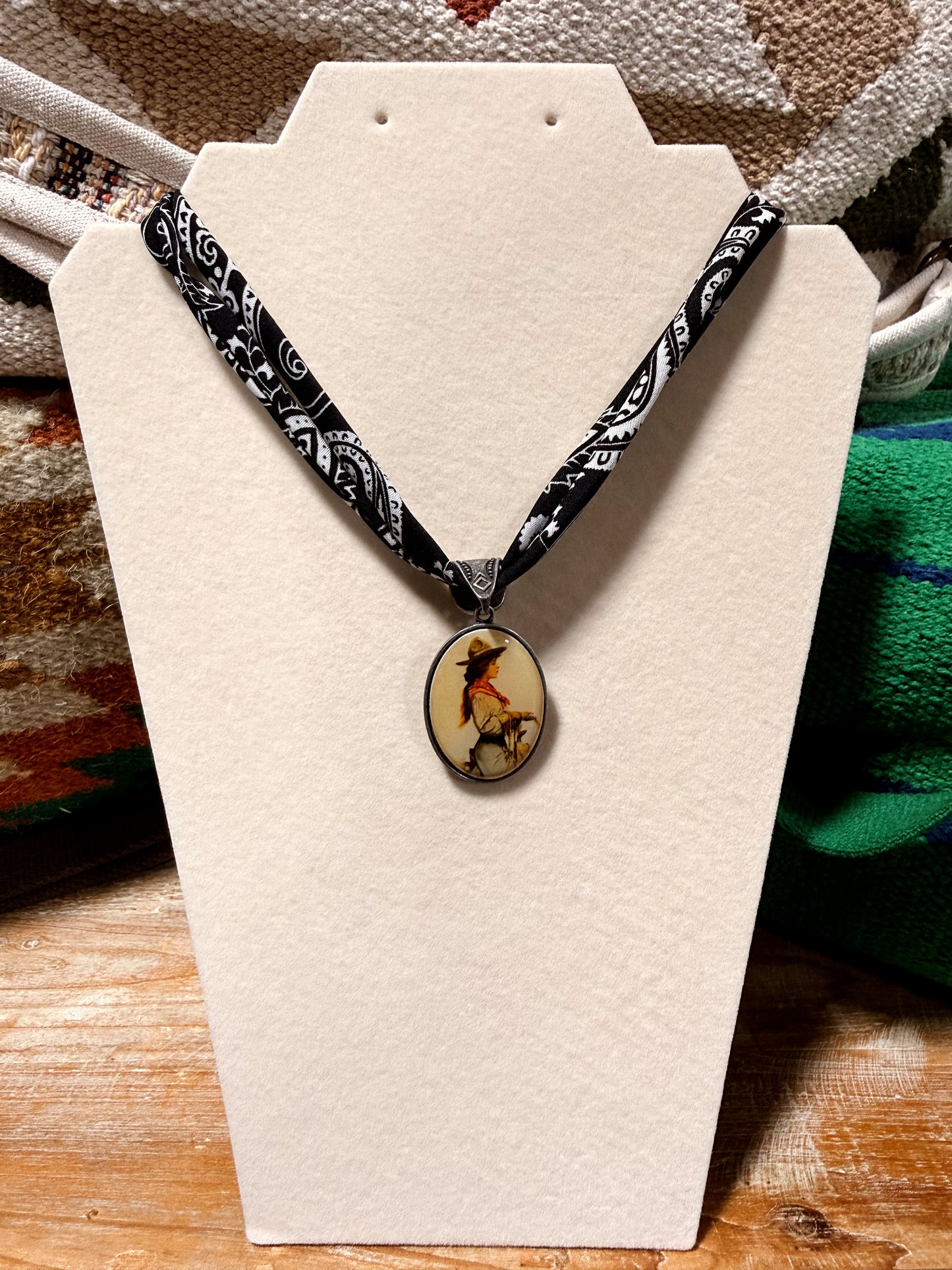 Necklace with a pendant on a display card, with a blurred background